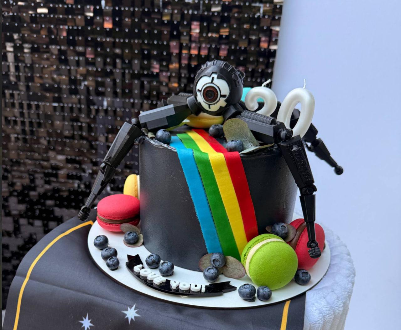 A homemade cake with an ARC Raiders emblem, courtesy of a raider's wife
